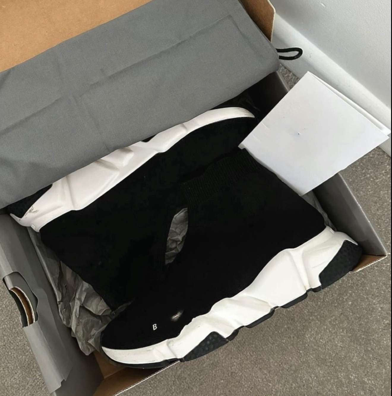 White and black trainers